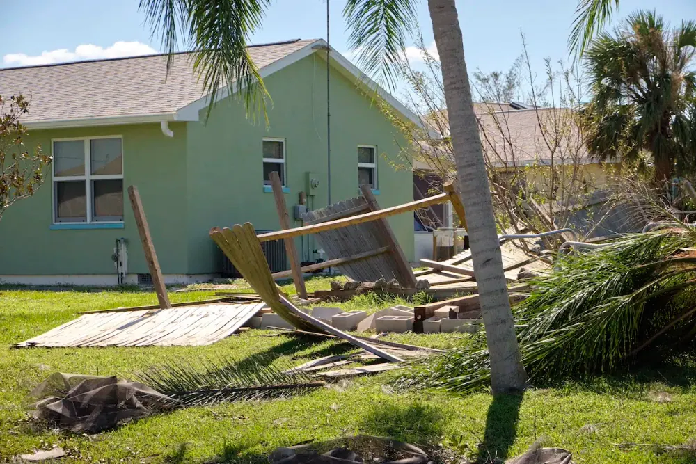 Scattered debris in a Florida backyard after a hurricane
